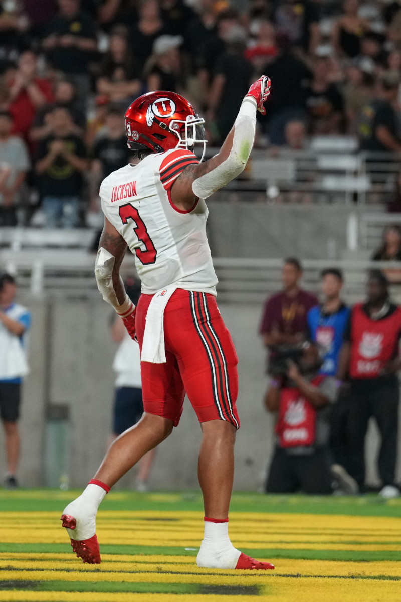 Utah Utes quarterback Ja'Quinden Jackson (3) celebrates his touchdown against the Arizona State Sun Devils during the first half at Sun Devil Stadium.